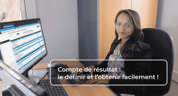   La directrice de la branche Ezaka Madame Harisoa experte en externalisation  de traitement fichier, comptabilité, paie, administration des vents devant son bureau une machine calculer.